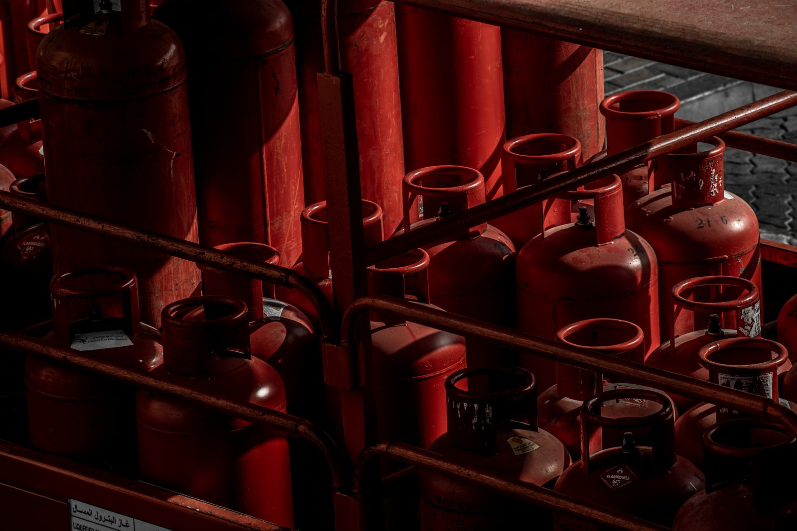 Rows of sealed LPG cylinders in storage racks