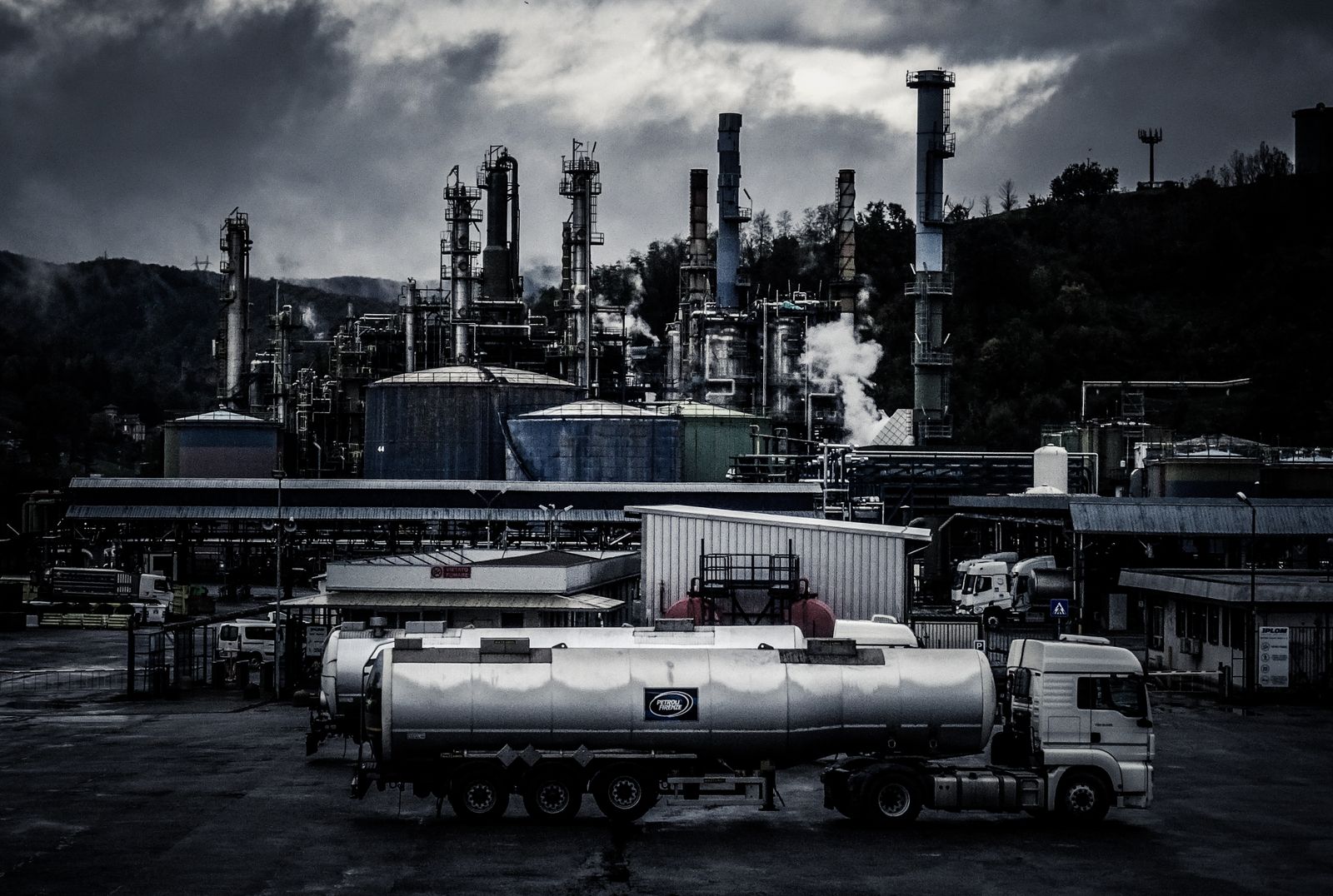 Storage tanks and tanker trucks at a gas plant